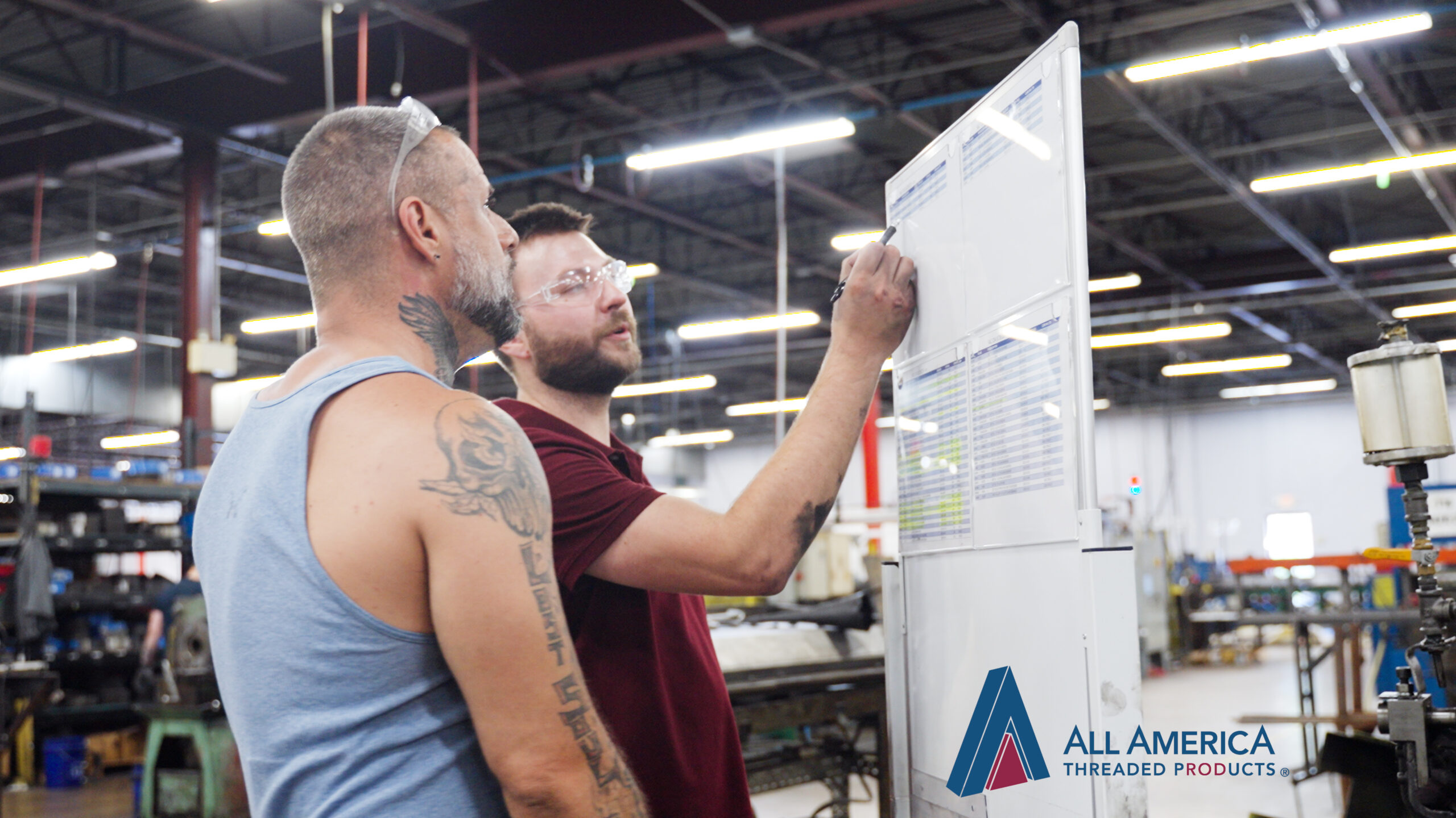 Chris Assisting a Machine operator at the threaded rod manufacturing facility in Lancaster Pennsylvania